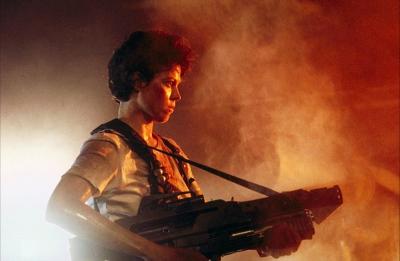 Sigourney Weaver Holding a Gun in both hands